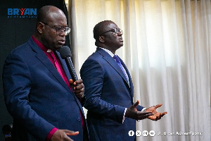 Dr Bryan Acheampong receiving prayer from the Presbyterian clergy