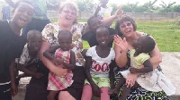 Jane Davison and Connie Peterson with some kids in the orphanage