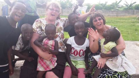 Jane Davison and Connie Peterson with some kids in the orphanage