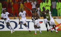 Emmanuel Agyemang-Badu celebrating after scoring the winning penalty