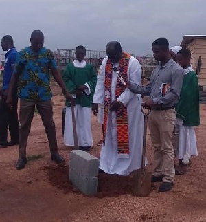 Very Rev. Fr. James Yeboah cutting sod for the construction of the three facilities