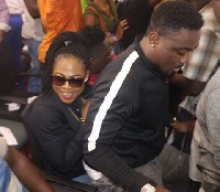 Actor Toosweet Annan was seen comfortably seated on the laps of a smiling Joyce Blessing
