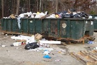 Residents disregard the bins and pour waste around