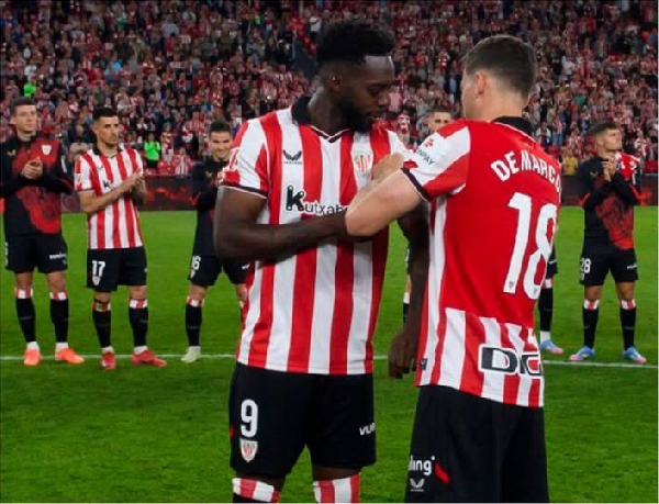 Óscar De Marcos handing over the captain's armband to Inaki Williams