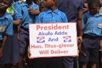 School pupils lined up with placards to welcome President Akufo-Addo into the Tema East Constituency