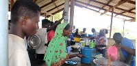 Some of the refugees who fled from Khartoum in Sudan following continued fighting, receive food