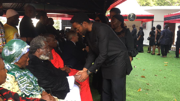 Okronkronyi Nyame Somafo Yawoh in a handshake with Kimathi Agyeman-Rawlings