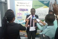 Country Director of CUTS International, Ghana, Mr Appiah Kusi Adomako (C)