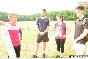 Hearts coach Kenichi Yatsuhashi having a chat with the three physiotherapists.