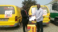 Charles Kwadwo Ntim in a handshake with a Samara Manufacturing Limited official