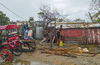 Residents rebuild a structure in the city of Toamasina, on the east coast of Madagascar