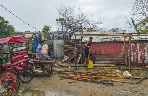 Residents rebuild a structure in the city of Toamasina, on the east coast of Madagascar Residents rebuild a structure in the city of Toamasina, on the east coast of Madagascar