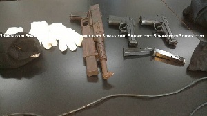 A display of guns confiscated by the police from suspected armed robbers