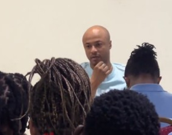 Dede Ayew (fair in complexion) engaging the Black Queens players