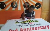 Nana Oye Lithur signing the Montie petition
