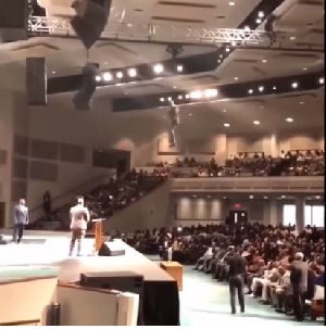 The pastor in a dramatic entrance to the auditorium