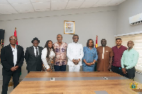 Kofi Adams pictured with the Local Organizing Committee
