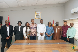 Kofi Adams pictured with the Local Organizing Committee