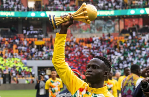 Senegal’s Krépin Diatta celebrates with the AFCON trophy