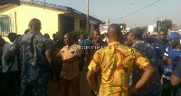 Some voters and police officers at a voting centre