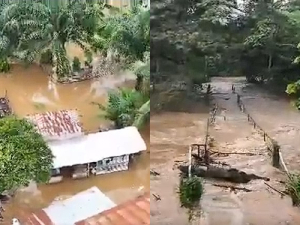 Snipped of homes submerged in the flood waters