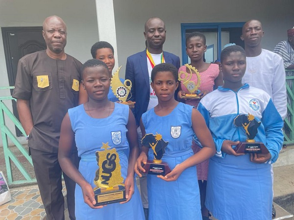 Students display the awards they won at the Ghana Education Awards