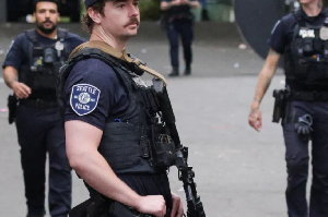 Police stand guard after what they described as a shooting with