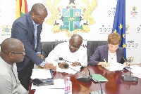 Finance Minister Ken Ofori-Atta and Ms Diana Acconcia, EU Ambassador to Ghana signing documents