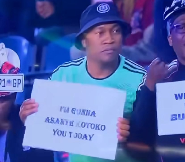 A Pirates fan held this placard during a match