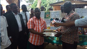 Director of the NGO, Apostle Michael Ankrah making the donation