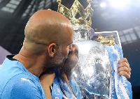 Manchester City coach Pep Guardiola and the PL trophy