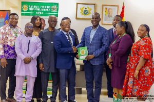 Haruna Iddrisu pictured with the management of NPRA during their visit