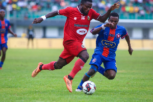 Asante Kotoko's Amoah (L) getting past an opponent