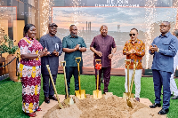 A picture of President Mahama standing with the Chairman of Sentuo Group and other dignitaries