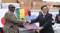 Mr Mark Woyongo receiving relief items from Japanese Ambassador, H.E. Kaoru Yoshimura
