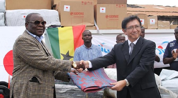 Mr Mark Woyongo receiving relief items from Japanese Ambassador, H.E. Kaoru Yoshimura