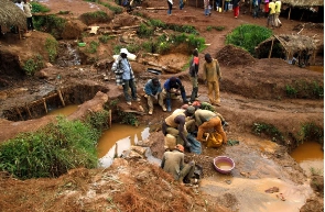 Miners pan sediment for gold at an illegal mine pit in South Kivu province near Bukavu