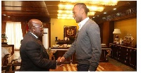 President Akufo-Addo in a handshake with the Ivory Coast star, Didier Drogba