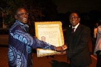 Dr. Abubakr Sidick Ahmed being awarded for his exploits