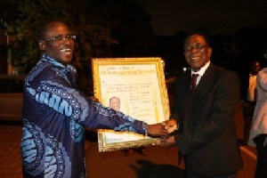 Dr. Abubakr Sidick Ahmed being awarded for his exploits