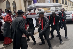 Dancing pallbearers performing at a funeral