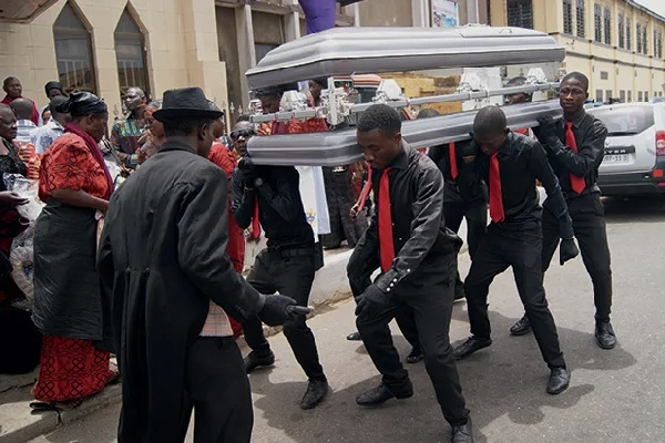Dancing pallbearers performing at a funeral