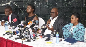 Normalisation Committee members seated at a press conference