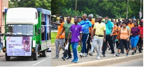 Staff of Access Bank walk the streets of Accra