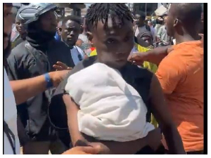 Snipped photo of the young man with the newborn baby