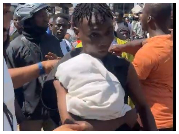 Snipped photo of the young man with the newborn baby