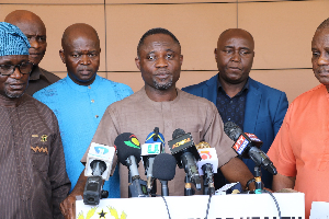 Minister of Health, Kwabena Mintah Akandoh behind the microphone