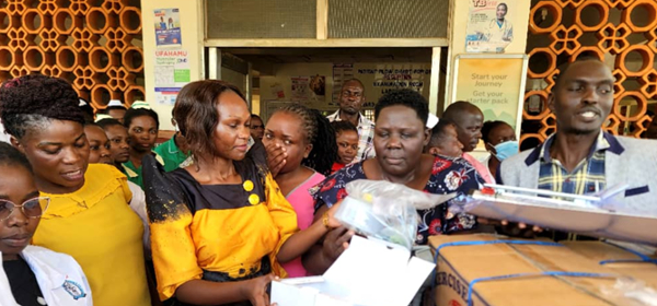 Busia Woman MP hands over medical equipment from the midwives’ kit to Dr Bena Nanyama