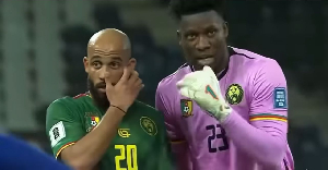 Onana (R) giving instructions to Mbeumo (L)