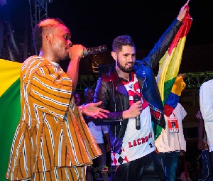 Macassio with Colombian rapper, Mc Dementor on stage